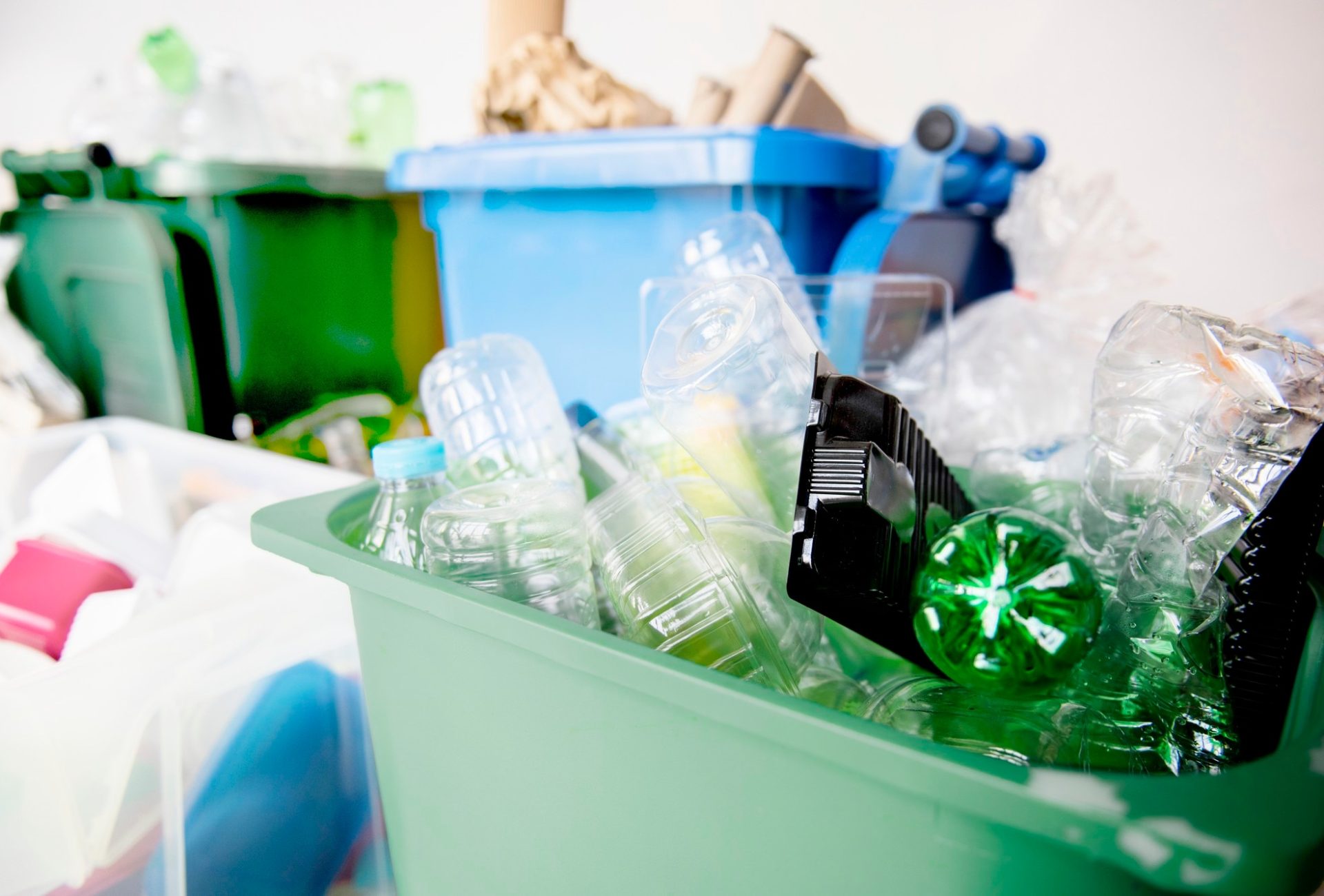 used-plastic-bottles-recycling-bins-earth-day-campaign_53876-104848